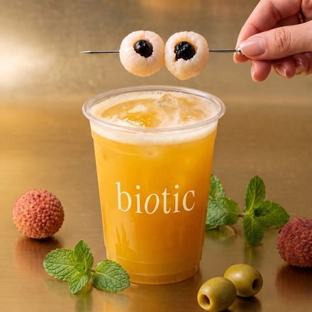 Biotic cup garnished with lychees and mint