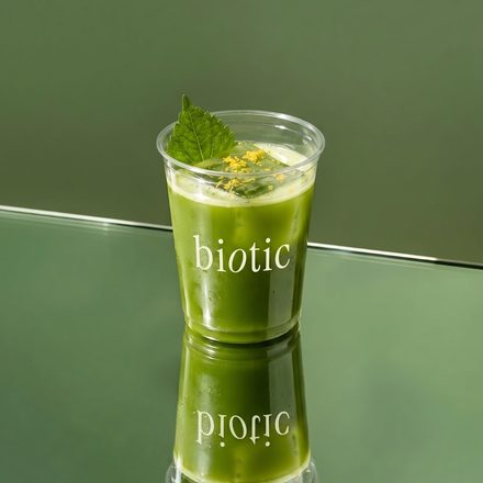 Green biotic drink on a green surface