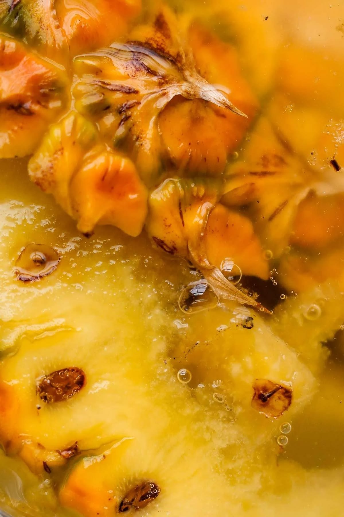 Close-up of pineapple pieces fermenting in their own juice
