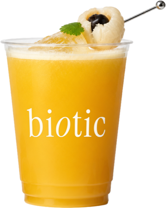 Golden lychee and passion fruit drink in a plastic takeaway cup with a lychee garnish